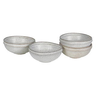 Set of four Lulworth speckled stoneware bowls in reactive cream glaze with warm brown flecks
