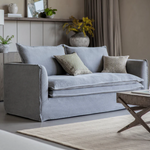 Stone washed linen sofa with deep cushions and modern slipcover style in a contemporary living room