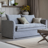 Stone washed linen sofa with deep cushions and modern slipcover style in a contemporary living room