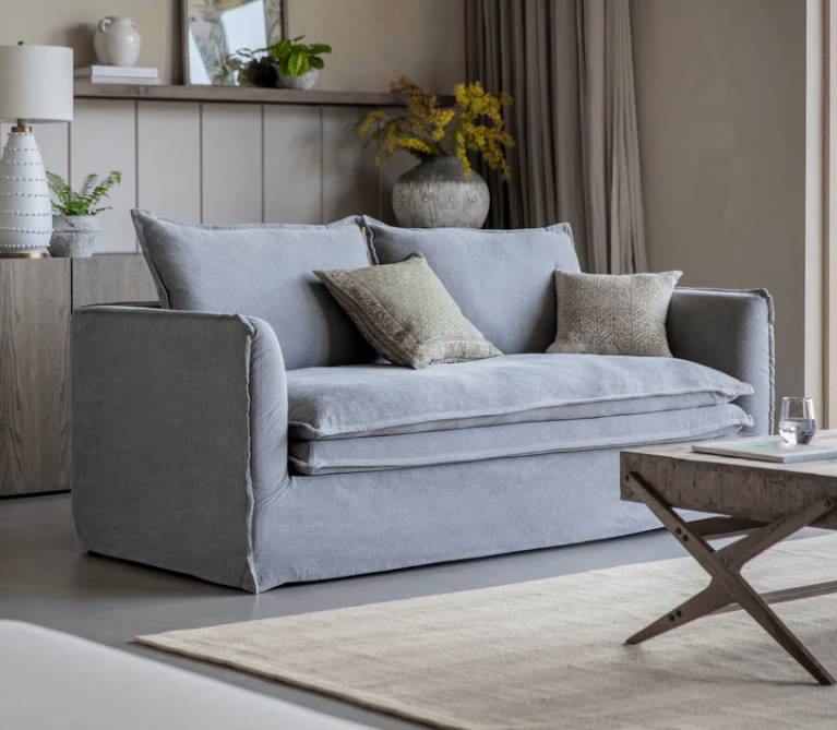 Stone washed linen sofa with deep cushions and modern slipcover style in a contemporary living room