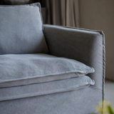 Gray sofa with cushions in a room setting
