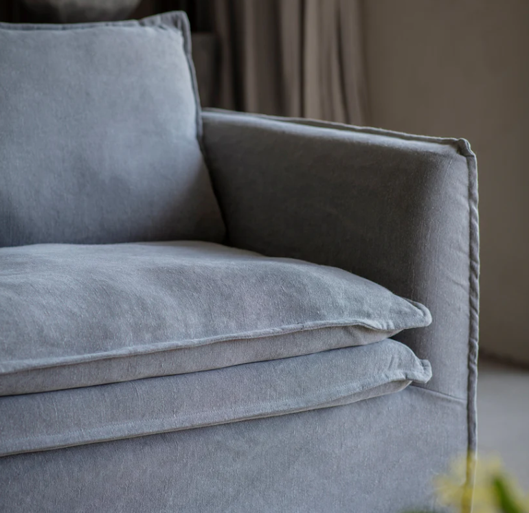 Gray sofa with cushions in a room setting