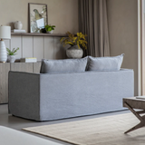 Stone washed linen sofa with deep cushions and modern slipcover style in a contemporary living room