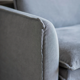 Stone washed linen sofa with deep cushions and modern slipcover style in a contemporary living room