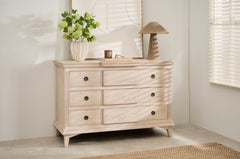 Longbourn Chest in room setting with lamp, vase, and artwork