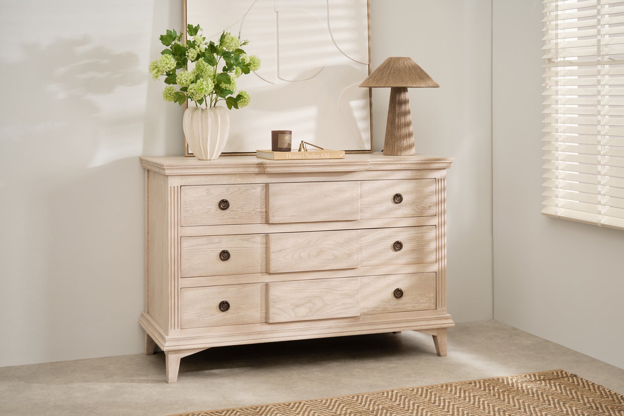 Longbourn Chest in room setting with lamp, vase, and artwork