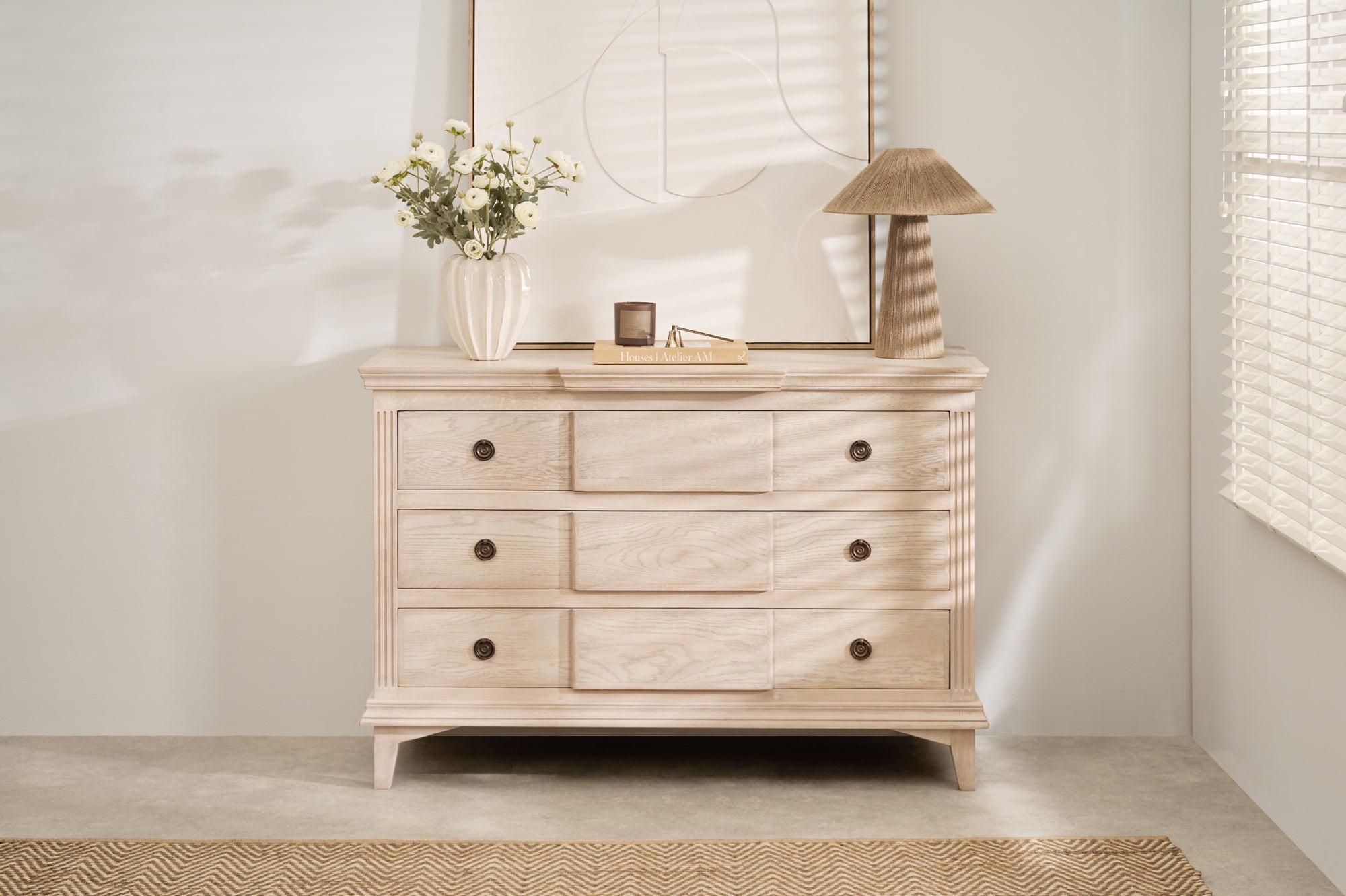 Longbourn Chest in room setting with lamp, vase, and artwork