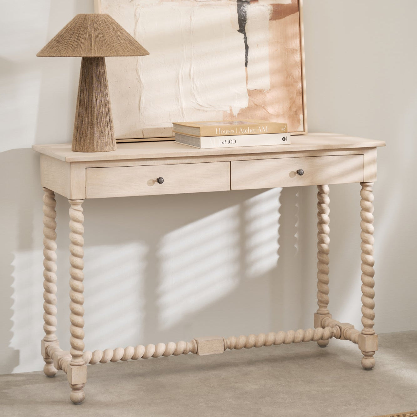 Longbourn Console Table styled with abstract wall art and lamp