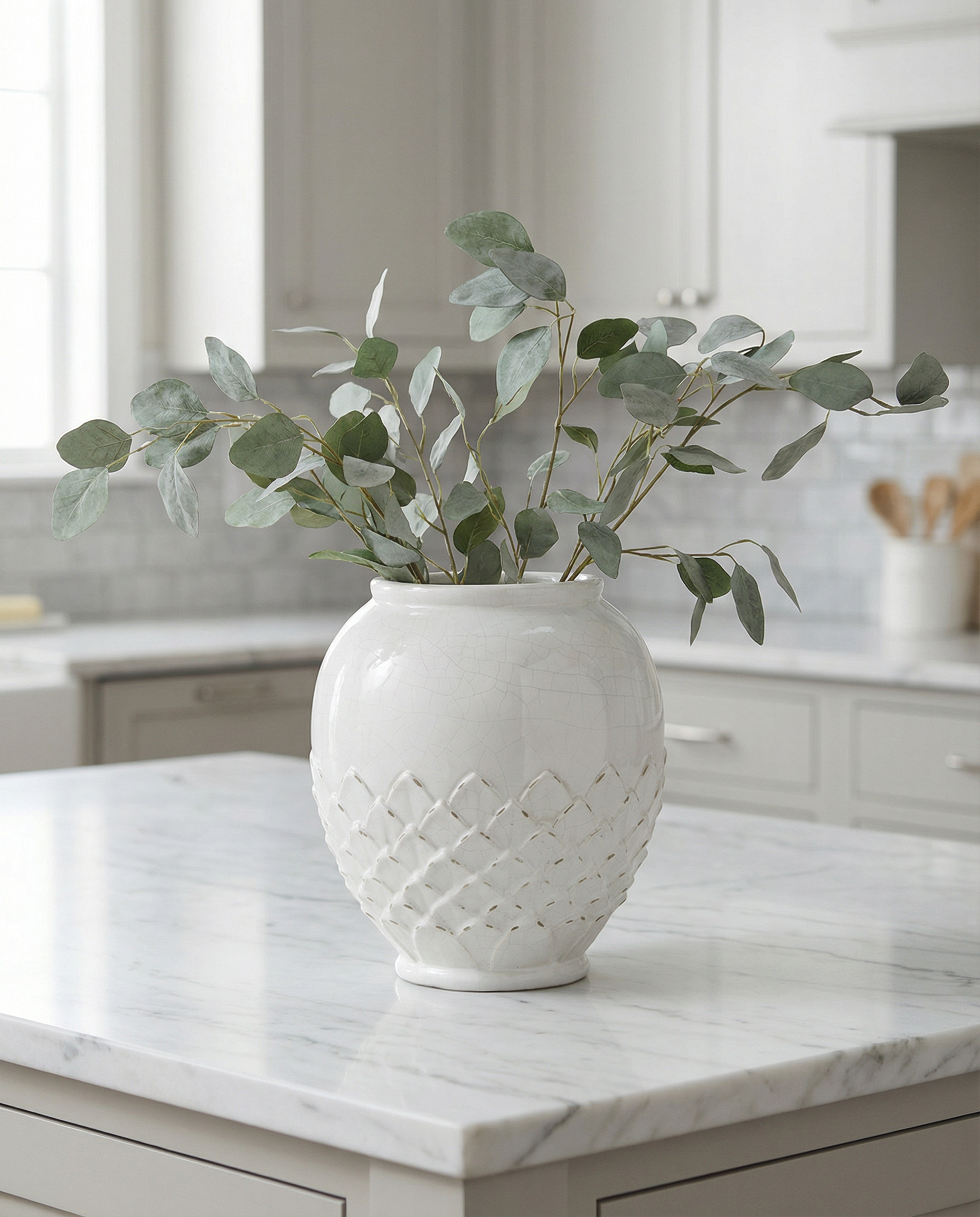 White lotus ceramic vase with woven pattern on a white background