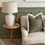 Lucia White Ceramic Table Lamp with beaded detailing and linen shade styled in living room
