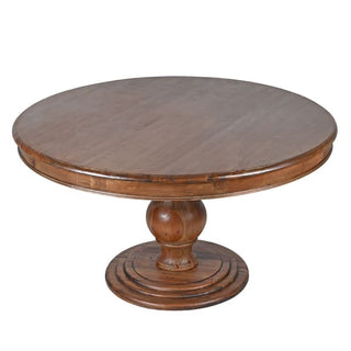 Ludlow round pedestal dining table showing warm pine top and stepped moulded base