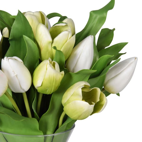 elegance of our luxury faux tulip Arrangement Complete with a stunning glass Vase. Featuring a mixture of open and closed white and green gorgeous tulips which feel real to the touch in a sleek glass vase, perfect for spring.