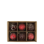 Set of six red and brown Christmas ornaments in a cardboard box on a white background