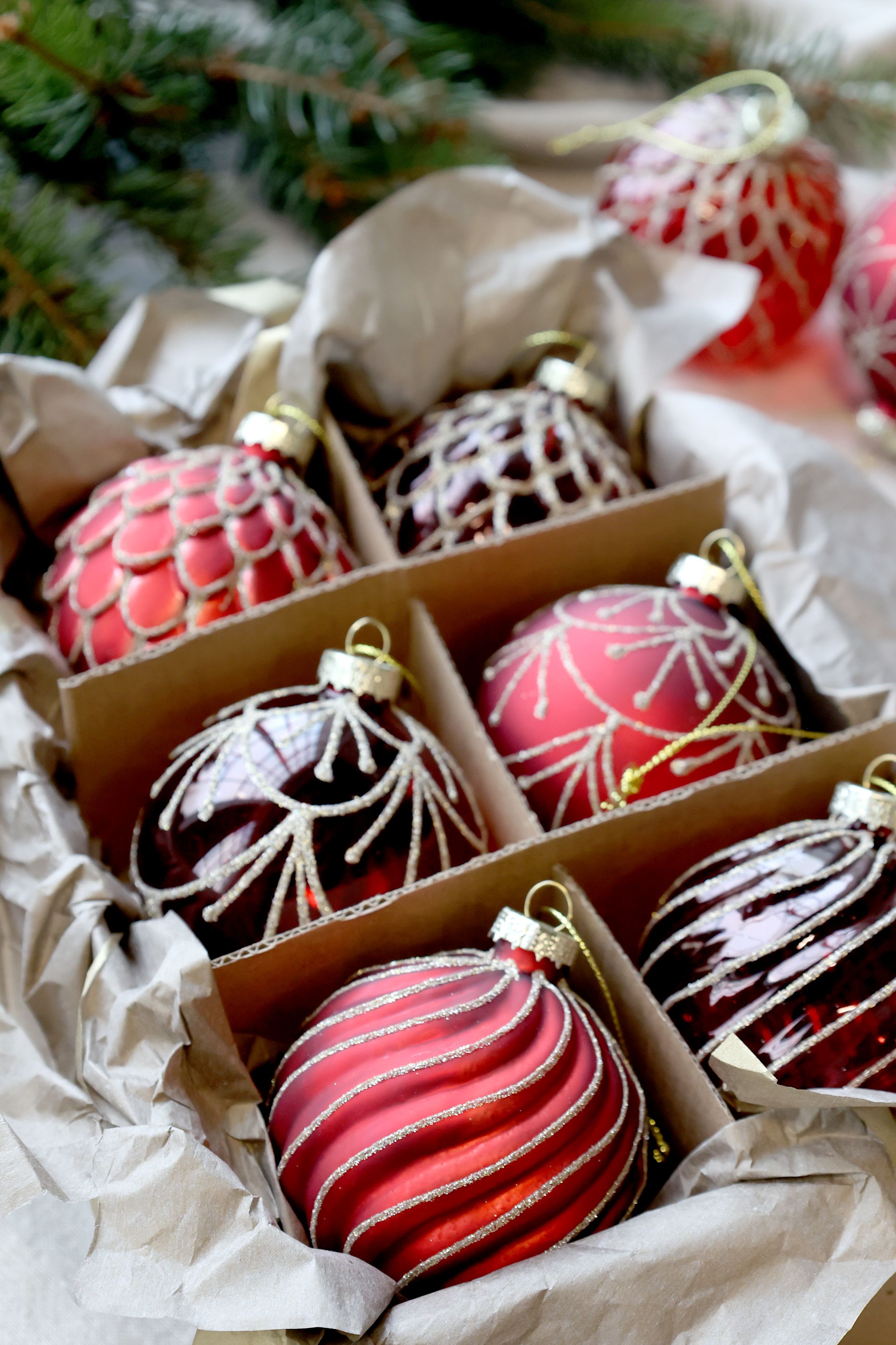 Decorative Christmas ornaments in a box with a festive background