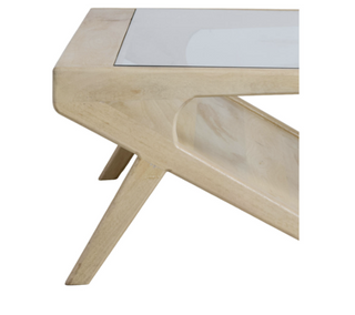 Close-up of Malmo coffee table showing angled splayed legs and pale mango wood grain