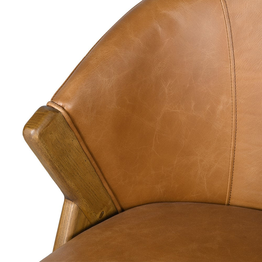 Curved backrest tan leather chair with angled wood legs