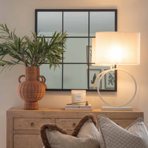 Elevate your home décor with this modern circle table lamp, featuring a sleek white circular base and an elegant oval linen shade—perfect for slim spaces like narrow consoles, nightstands, or hallway tables. Designed for both style and practicality, this space-saving table lamp delivers a warm, ambient glow while enhancing the aesthetic of any room.

Ideal for living rooms, bedrooms, or entryway vignettes, this decorative lamp blends effortlessly with modern, minimalist, and transitional interiors. The uniq