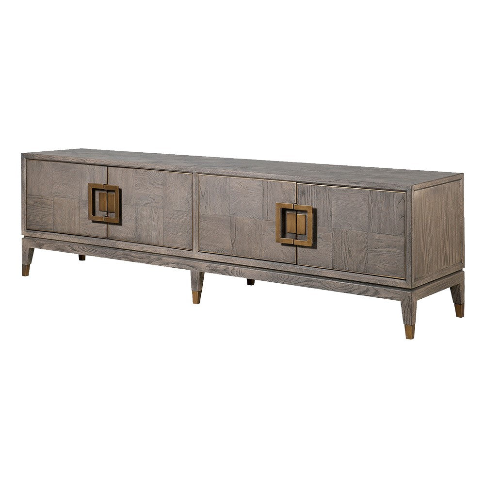 A gray TV unit with brass handles and a textured surface, with closed cabinets on the left and an open shelf on the right, supported by tapered legs.