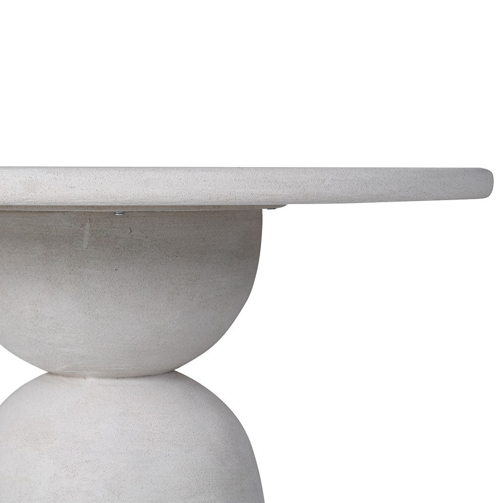 Side profile of geometric dining table showing layered base and top thickness
