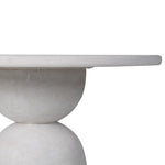 Side profile of geometric dining table showing layered base and top thickness