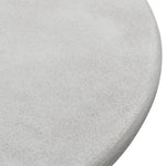 Close-up of the textured round tabletop – stone finish detail
