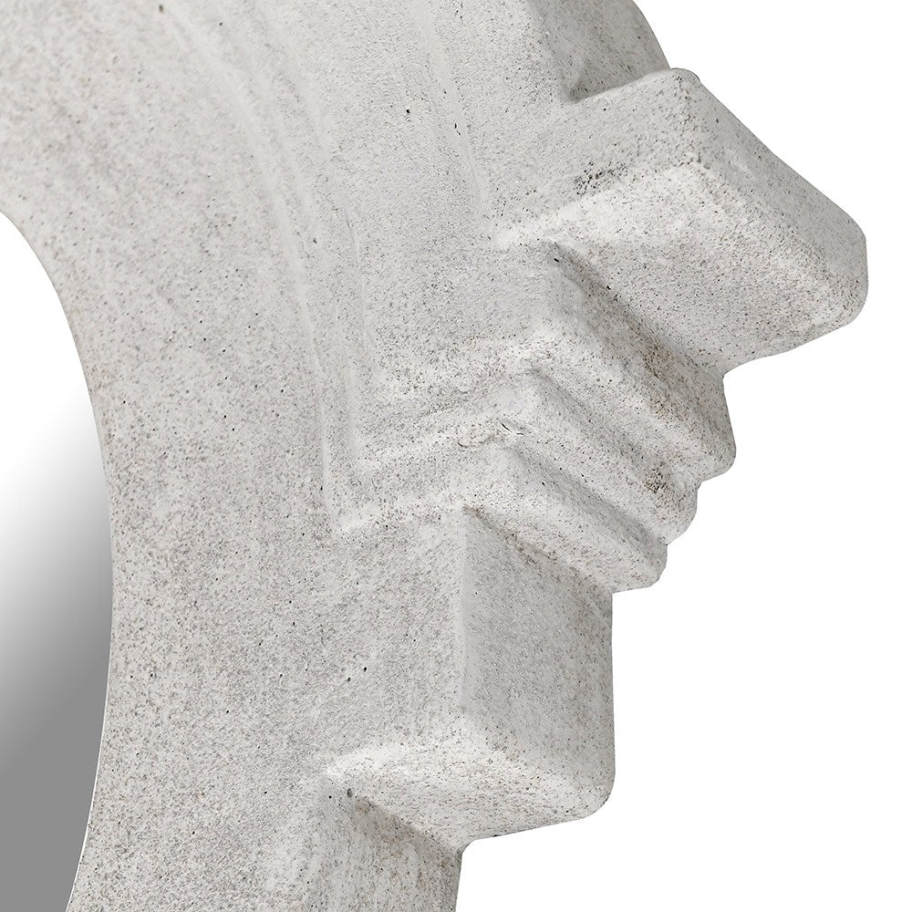 Close-up detail of white cast stone mirror frame with stepped corner design