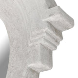 Close-up detail of white cast stone mirror frame with stepped corner design