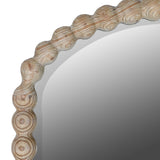 Natural wood arched floor length mirror with circular carved frame inspired by coastal design