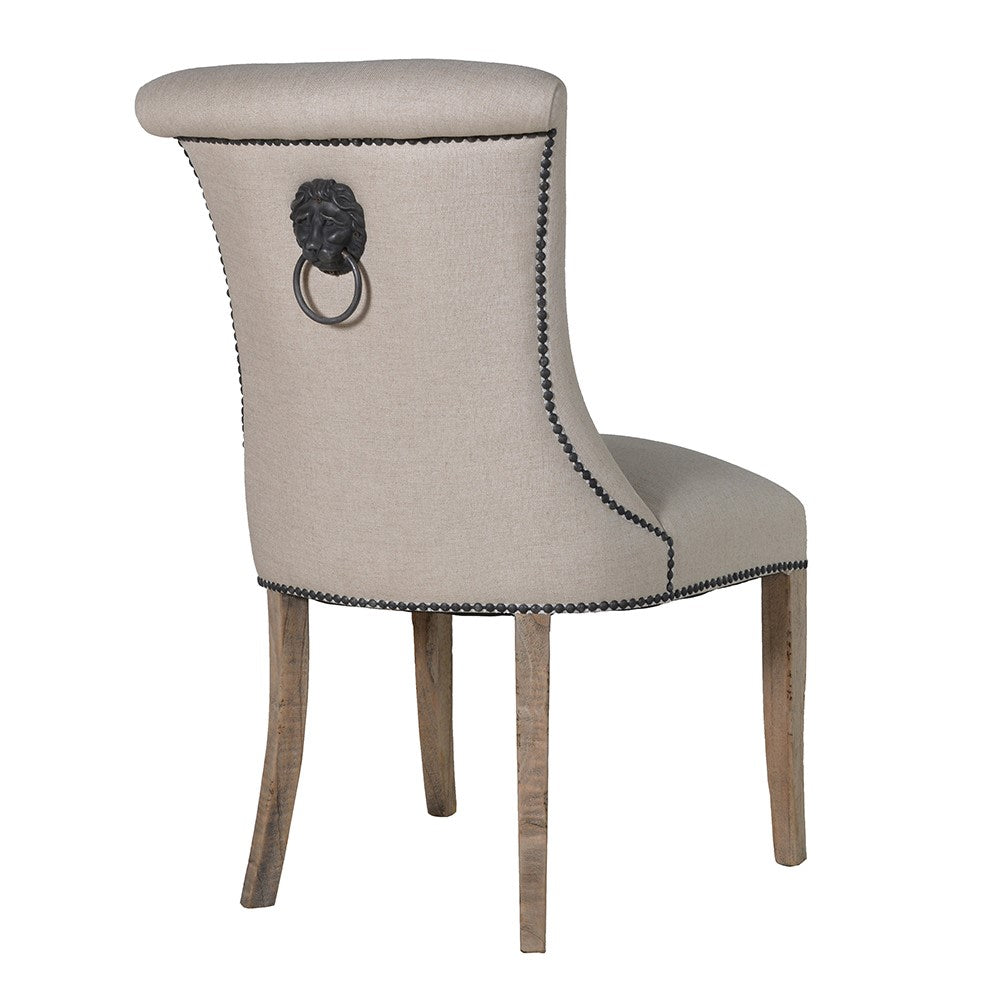 A striking dining chair in natural linen with stun detailing and ring back.