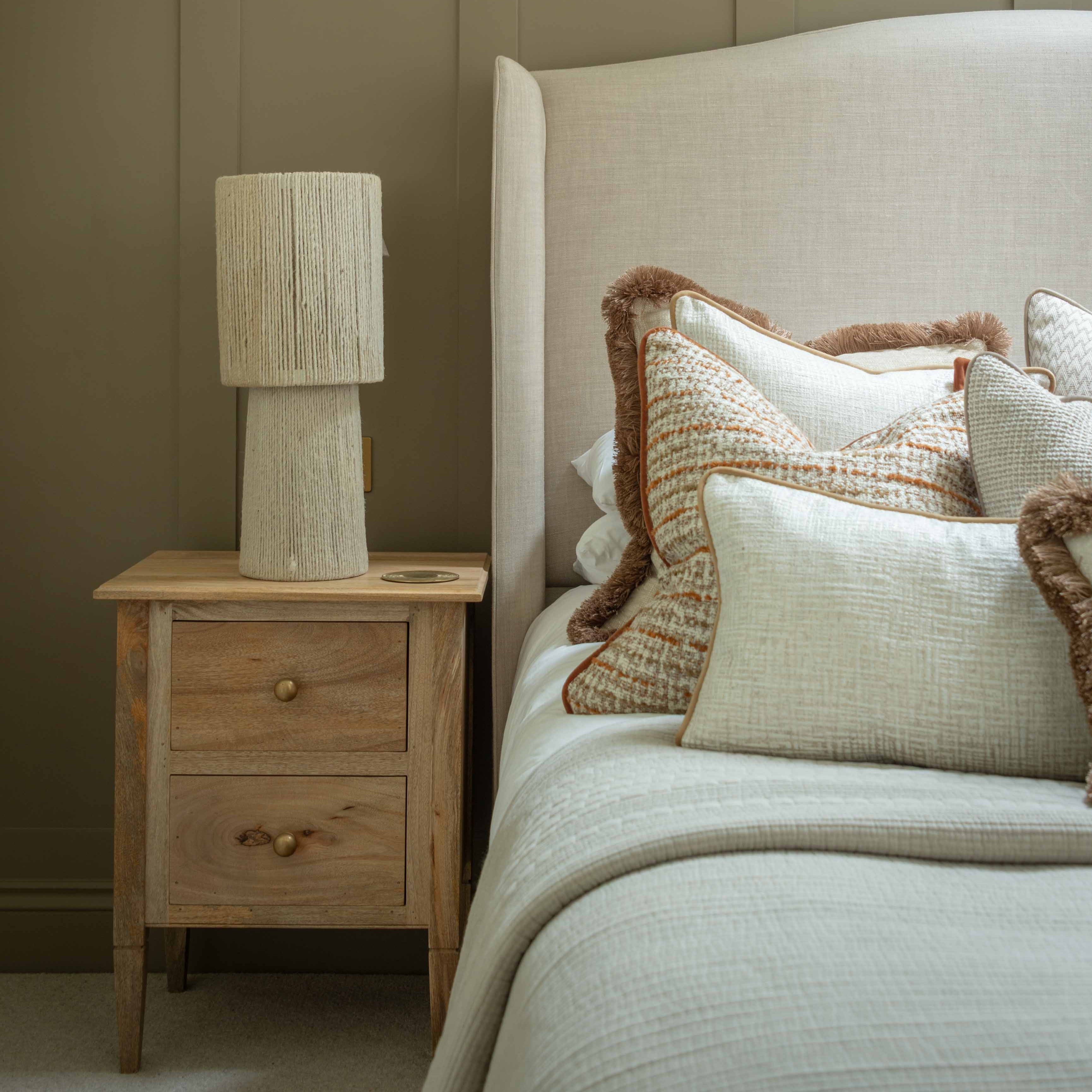 Elevate your space with this handcrafted jute table lamp, designed to bring organic warmth and minimalist charm to any interior. Featuring a textured natural jute finish and a sculptural silhouette, this boho-style bedside lamp is perfect for creating a cosy, earthy ambiance. Ideal for modern rustic bedrooms, Scandi-inspired interiors, or eco-conscious living rooms, this sustainable lighting piece blends functionality with artisanal beauty.

Place it on a nightstand, console table, or sideboard to highlight