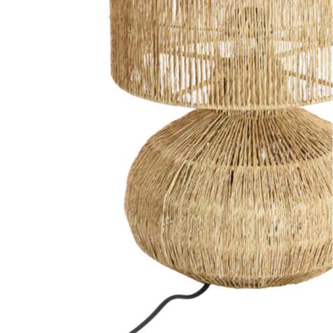 Rattan table lamp with a natural finish on a white background