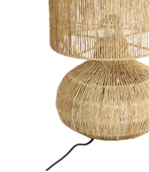 Rattan table lamp with a natural finish on a white background