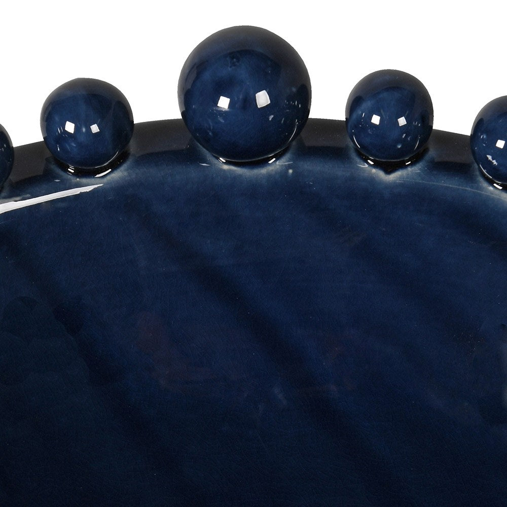 Textured navy blue ceramic bowl with sculptural bobble accents
