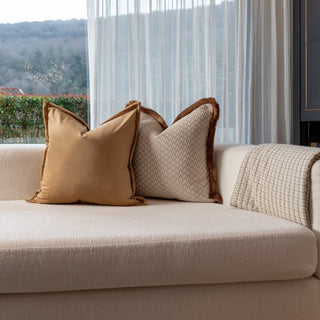 Lechlade cushion duo on a cream sofa in a light filled living room