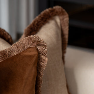 Chestnut velvet and champagne cushions styled together