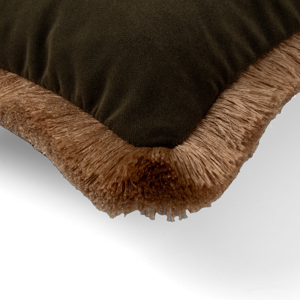 Naunton juniper gold fringe rectangle cushion styled on a sofa