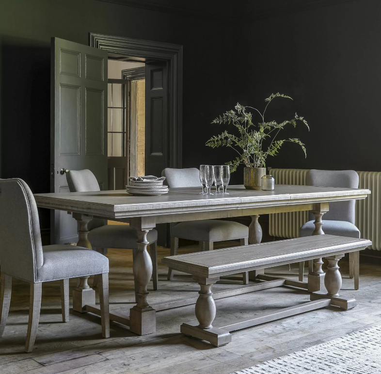 Bring refined charm and practical function to your dining space with the Oakridge Extendable Pine Dining Table. Crafted from solid pine wood with a weathered grey finish, this table effortlessly blends rustic elegance with modern sophistication. Its robust trestle base and expertly turned legs create a statement piece that anchors any room, while the smooth extendable mechanism transforms intimate dinners into grand gatherings with ease.

Perfect for family meals, festive celebrations, or stylish entertaini