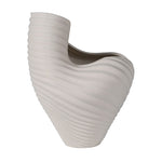 Asymmetrical sculptural white porcelain vase with ribbed wave design – front view