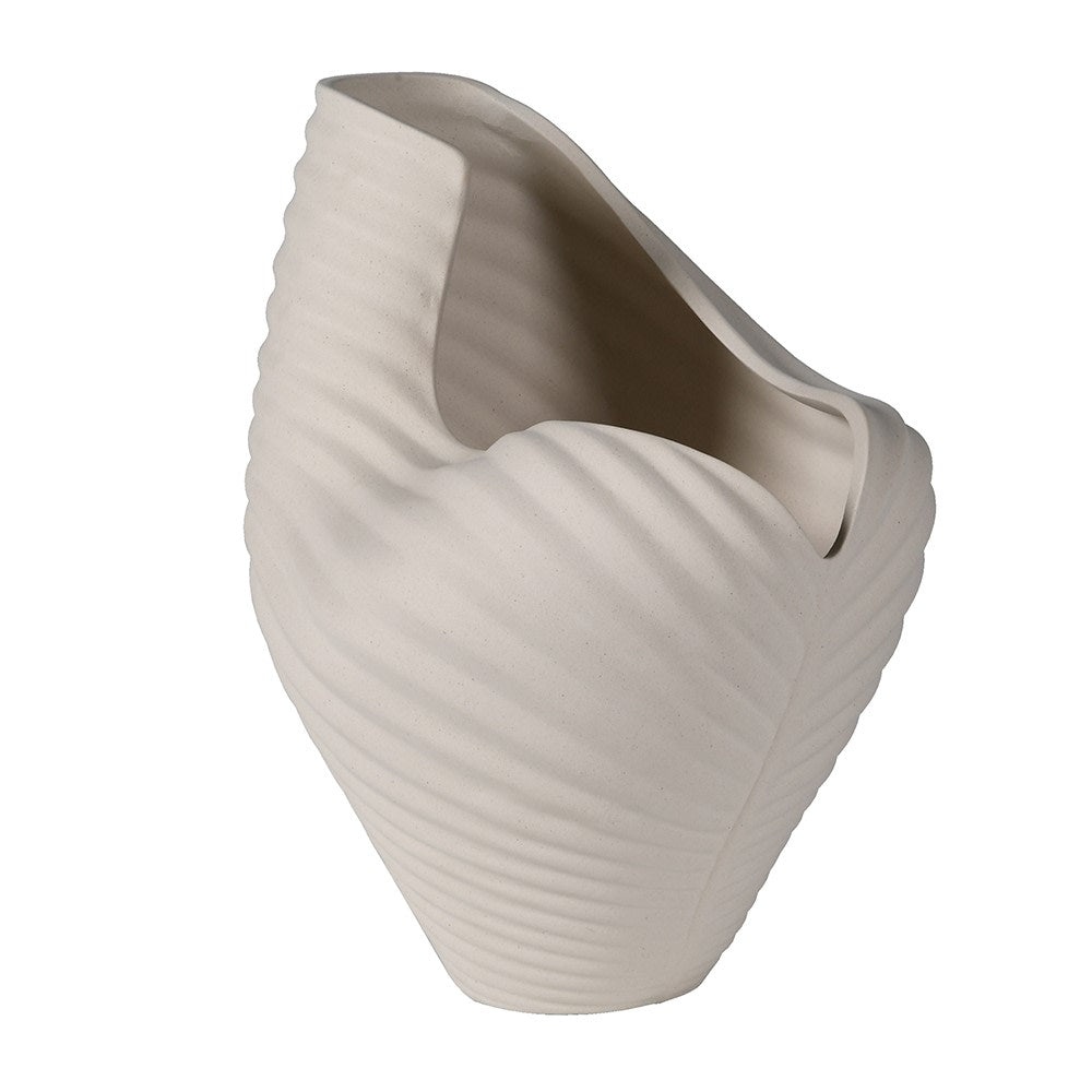 Side profile of sculptural ocean-inspired white ceramic vase