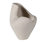 Side profile of sculptural ocean-inspired white ceramic vase