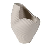 Side profile of sculptural ocean-inspired white ceramic vase