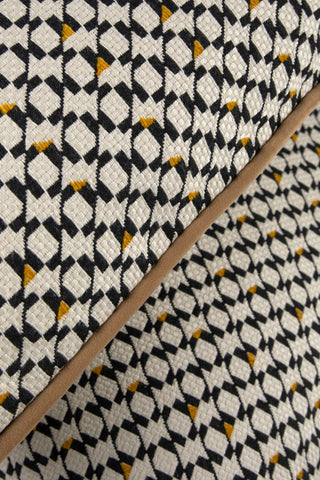 Filkins geometric rectangle cushion on an armchair