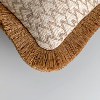Lechlade beige rectangle cushion with gold double fringe styled on a sofa