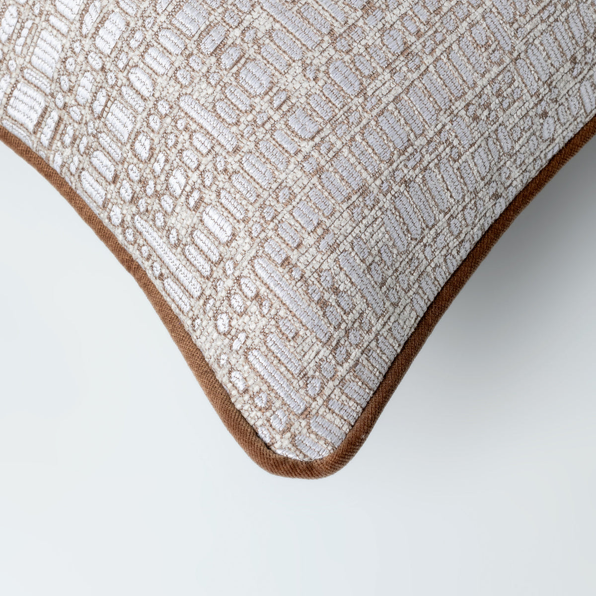 Kemble cushion styled on a neutral sofa