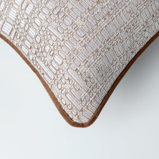 Kemble cushion styled on a neutral sofa