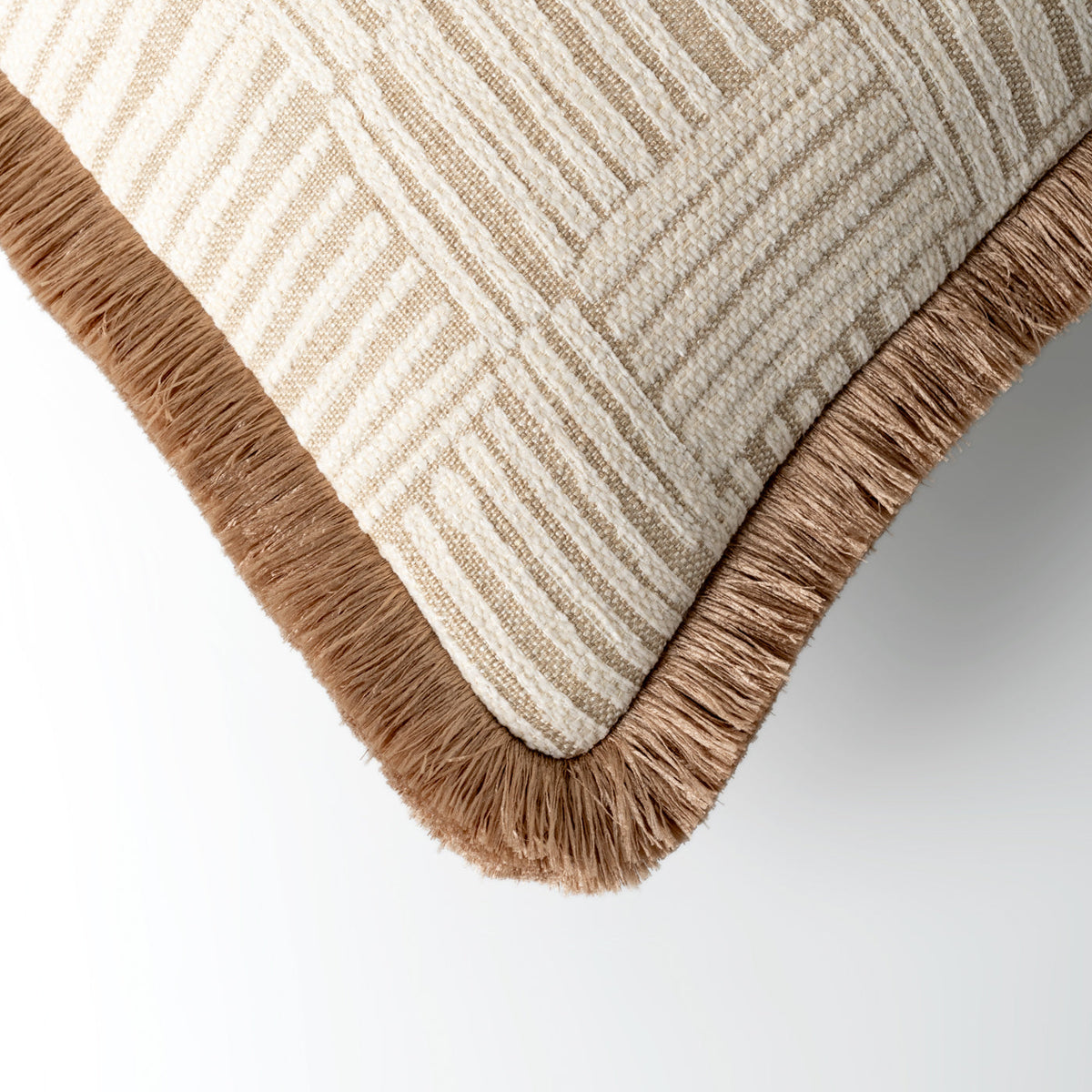Colesbourne fringed cushion styled on a sofa