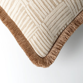 Colesbourne fringed cushion styled on a sofa