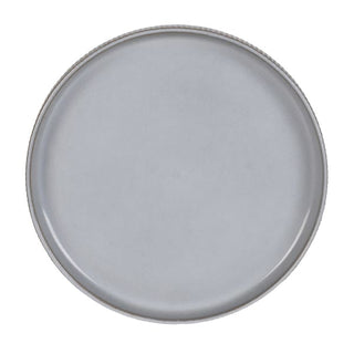 Overhead view of a fluted grey dinner plate with a raised lip