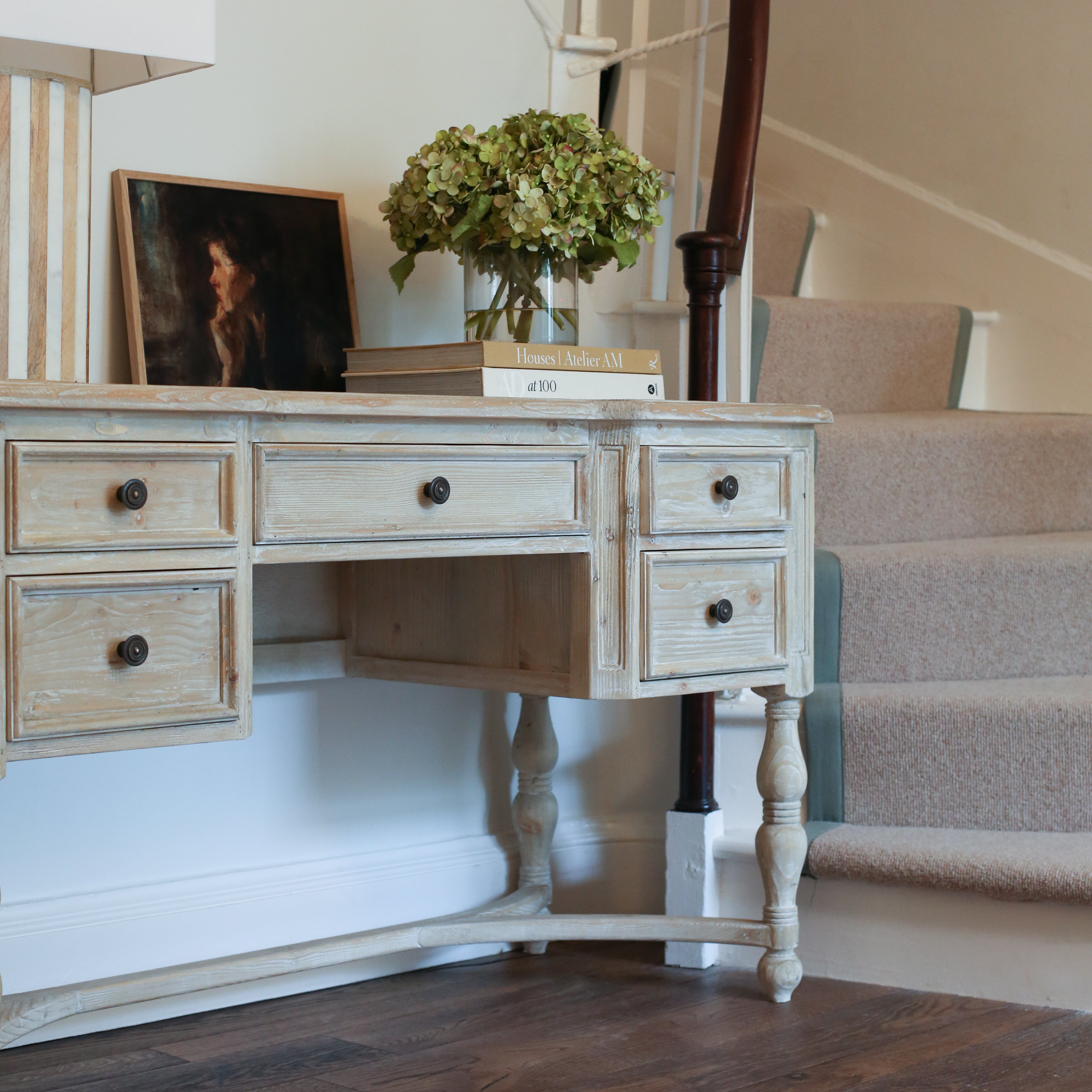 A Beautiful traditional reclaimed pine desk with five drawers and turned legs.