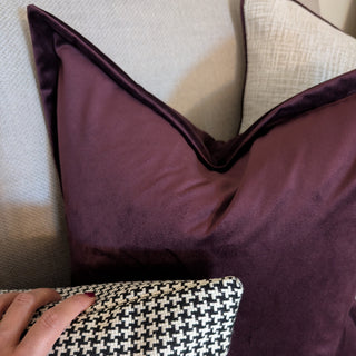 Harewood black and beige houndstooth rectangle cushion styled on a sofa